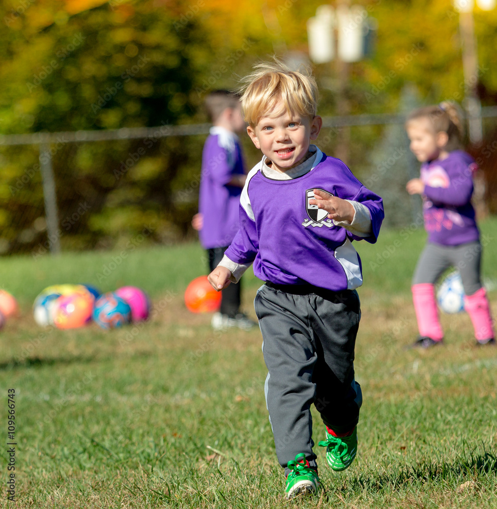 Naklejka premium Boy Playing Soccer