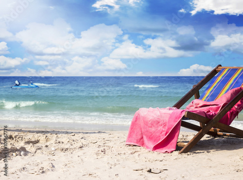 Towel on beach chairs at beautiful tropical beach