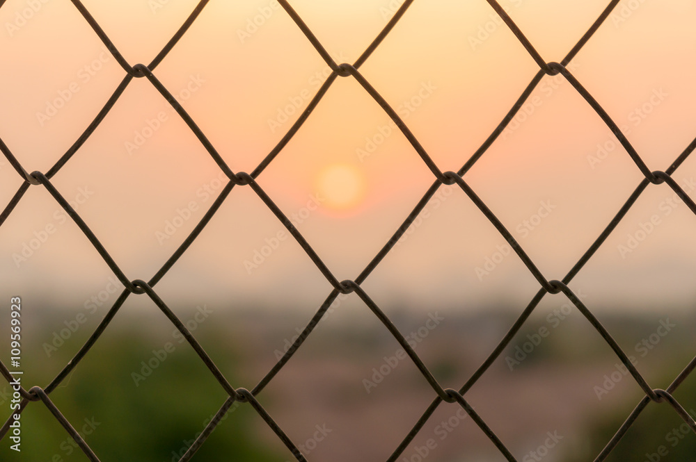 steel grate with sunset sky background steel grate with sunset sky background