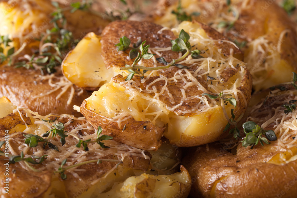 Australian new crash hot potatoes with thyme and cheese macro. horizontal
Australian new crash hot potatoes with thyme and cheese macro. horizontal