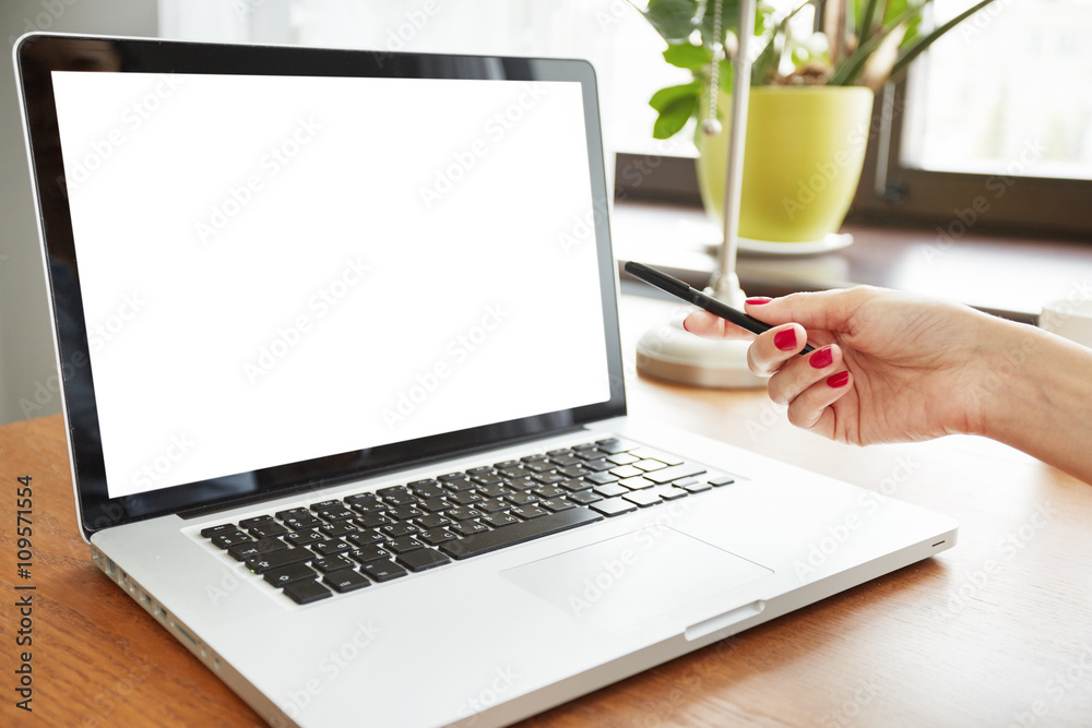Close up of laptop with blank copy space screen for your text or information content. Cropped portrait of young female designer showing her project on laptop, pointing at the screen. Selective focus Close up of laptop with blank copy space screen for your text or information content. Cropped portrait of young female designer showing her project on laptop, pointing at the screen. Selective focus
