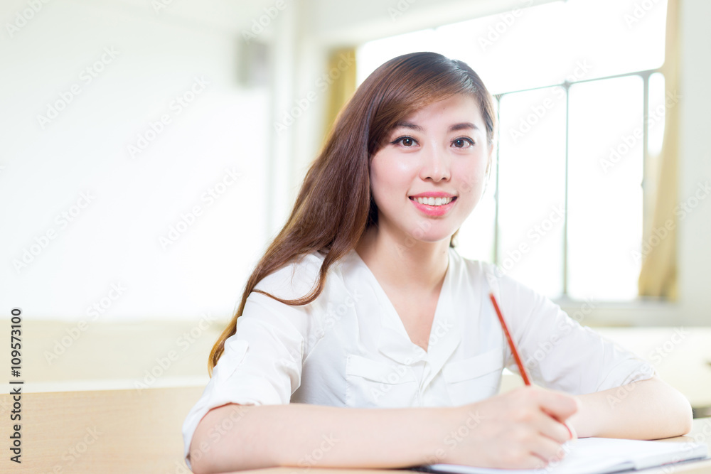 young beautiful asian girl student in classroom young beautiful asian girl student in classroom
