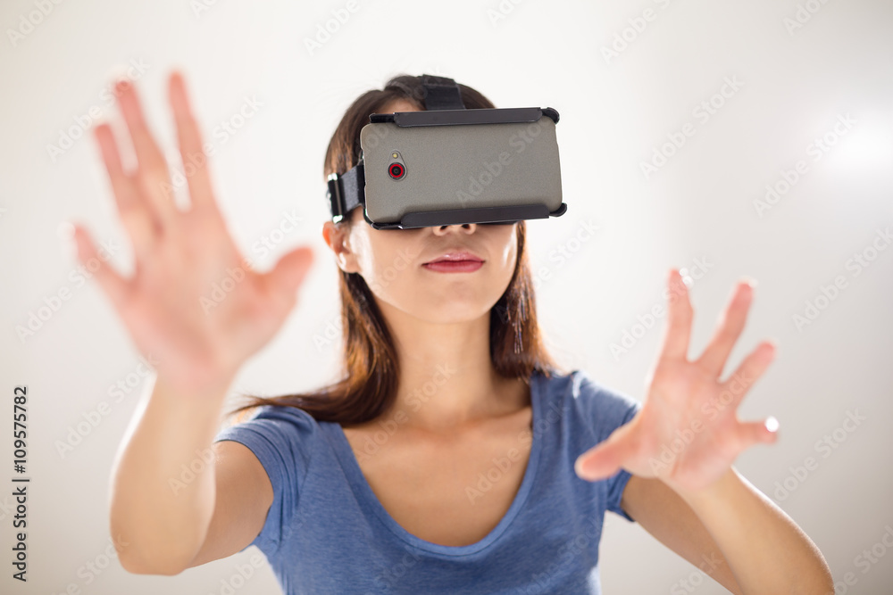 Woman looking though VR headset