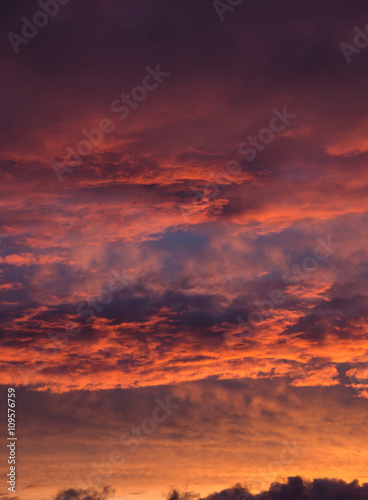 saturated colors colorful sunset . Summers are warm and beautiful sunset . Clouds filled with different colors of the rainbow . the sky as if drawn by an artist's brush © efimenkoalex