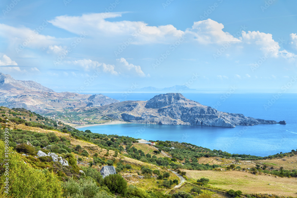 Beautiful panoramic view from the height on the Cretan settlement of Plakias with its beautiful hilly relief, beach and coastline of mediterranean sea.District of Rethymno.Crete island.Greece.Europe.