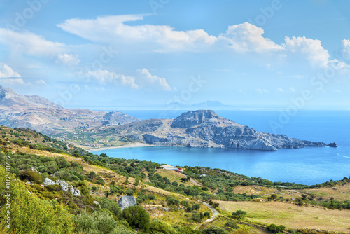 Beautiful panoramic view from the height on the Cretan settlement of Plakias with its beautiful hilly relief, beach and coastline of mediterranean sea.District of Rethymno.Crete island.Greece.Europe.