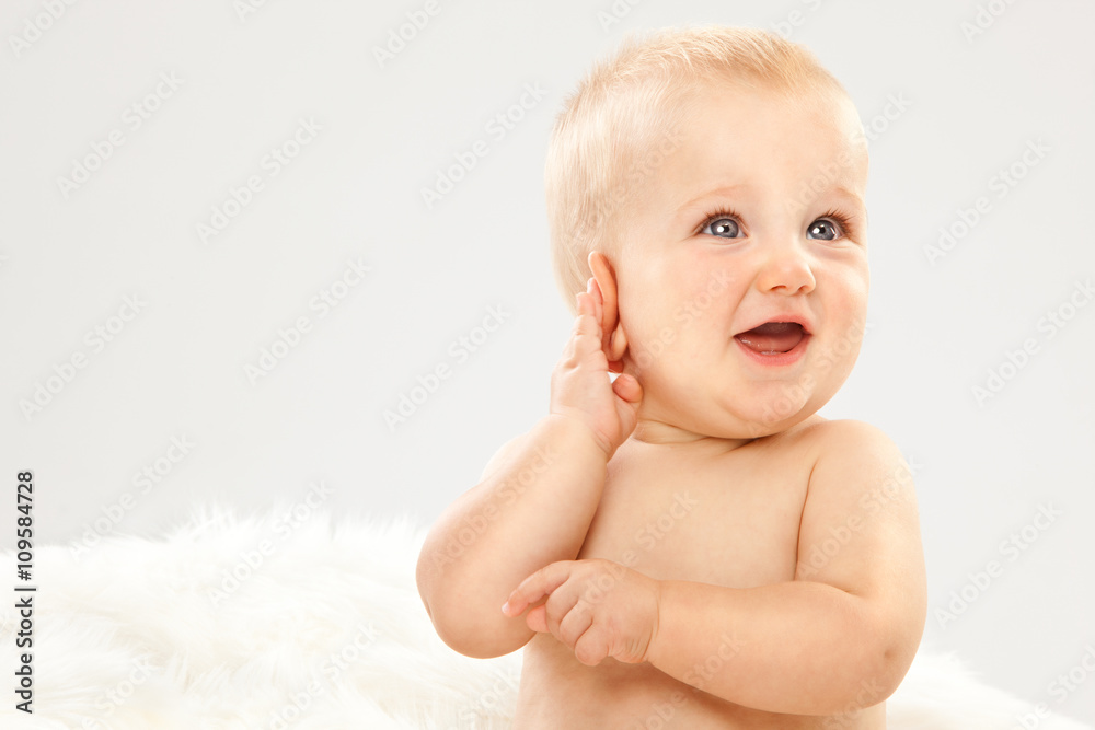 beautiful blonde hair blue eyes baby in a white room beautiful blonde hair blue eyes baby in a white room