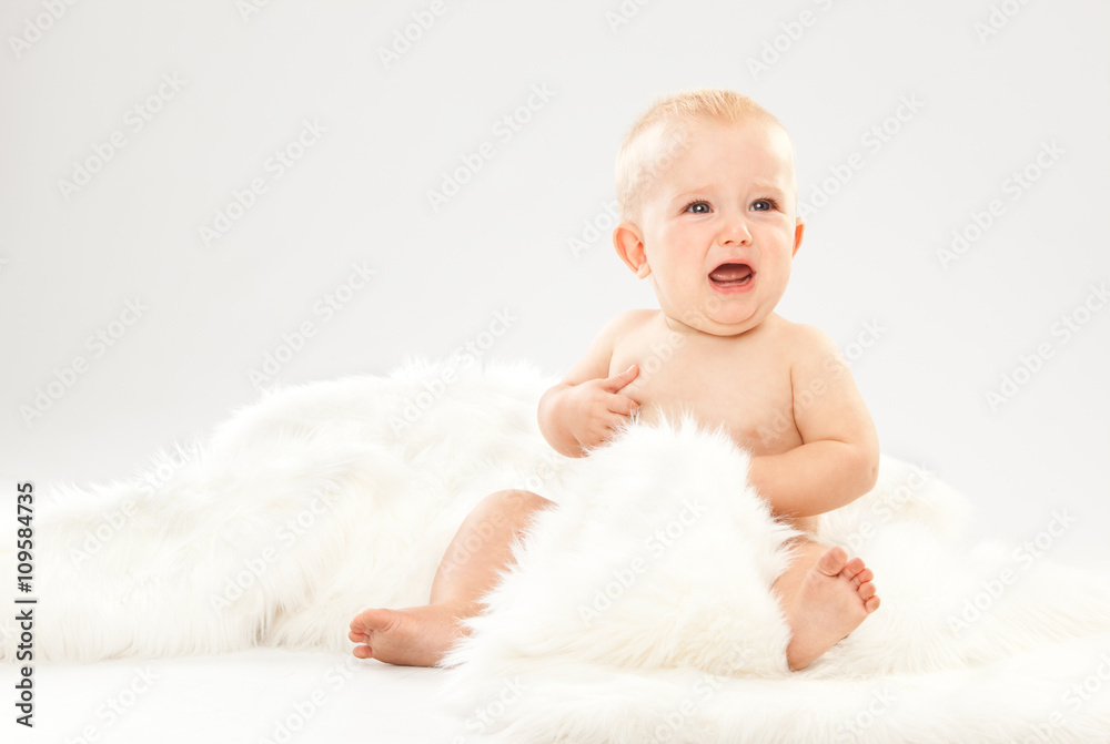 beautiful blonde hair blue eyes baby in a white room beautiful blonde hair blue eyes baby in a white room