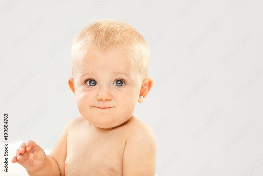 beautiful blonde hair blue eyes baby in a white room beautiful blonde hair blue eyes baby in a white room