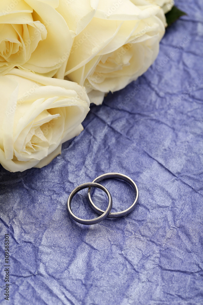 Silver wedding rings on a purple paper background Silver wedding rings on a purple paper background