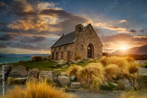 Beautiful sunrise at church of the good shepherd< Lake Takapo, New Zealand photo