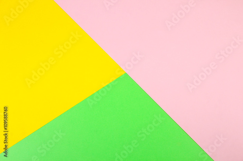 Color papers geometry flat composition background with yellow peach and green tones