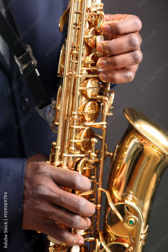 Obraz premium African American jazz musician playing the saxophone, closeup