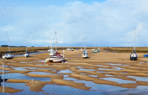 Photo Boats at low tide on the North Norfolk coast.