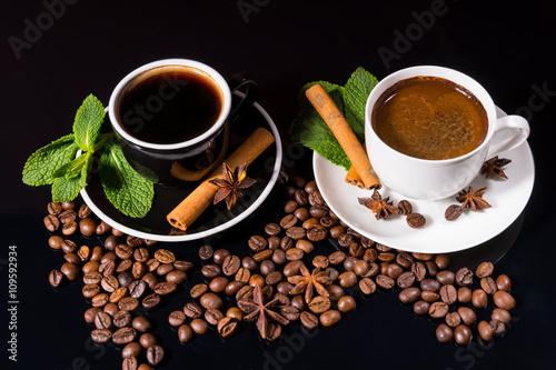 Two Cups of Black Coffee with Roasted Beans