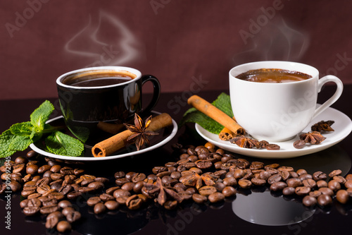Steaming Hot Cups of Coffee with Roasted Beans