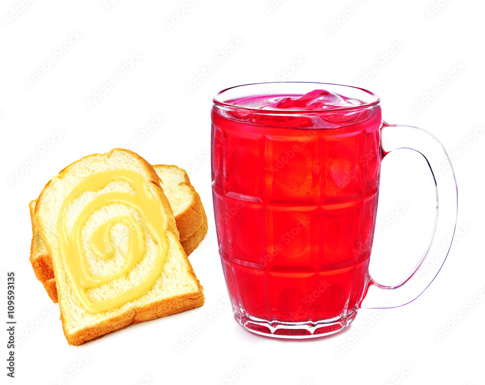 Red soda bread sprinkled with milk on white background