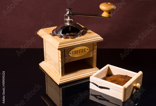 Traditional Hand Grinder with Fresh Ground Coffee