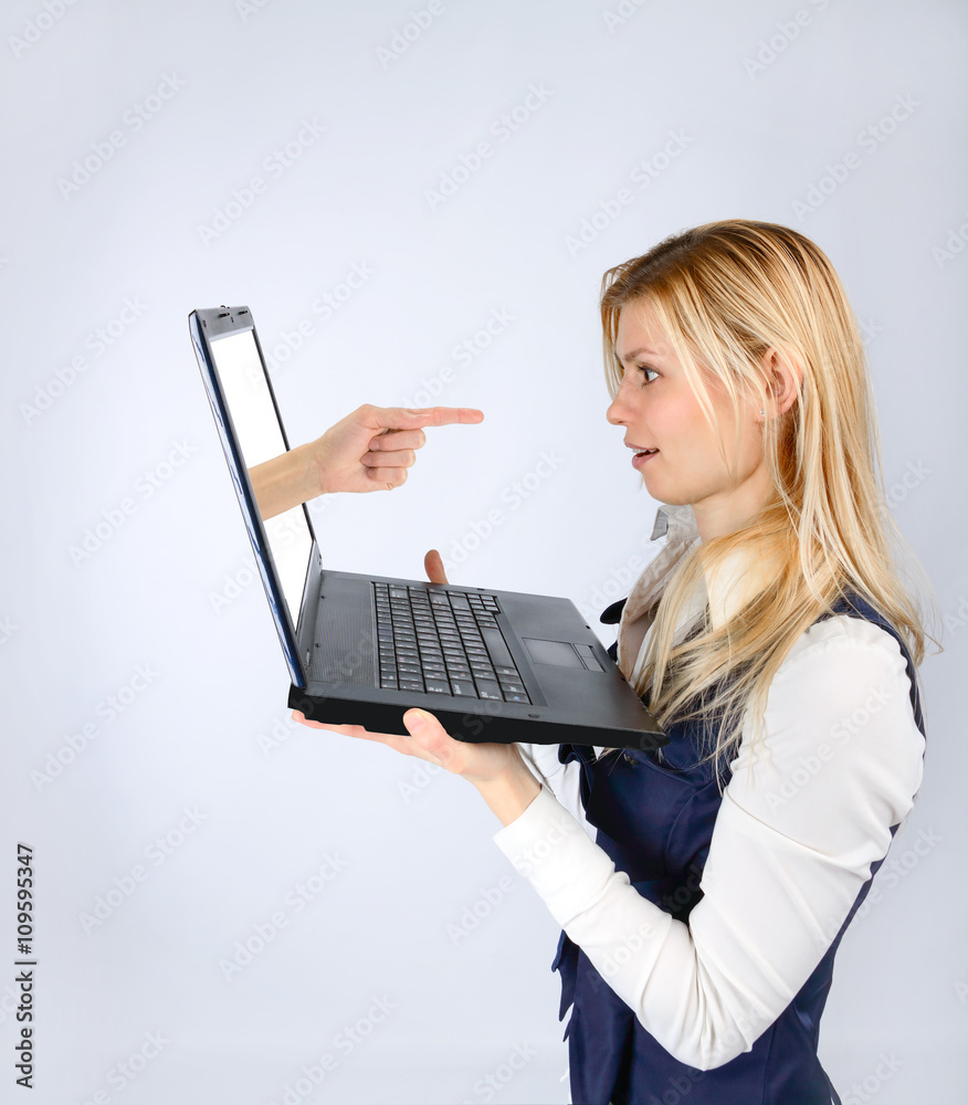 Surprised woman holding a laptop and hand Surprised woman holding a laptop and hand