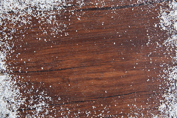 Snowy brown wooden background