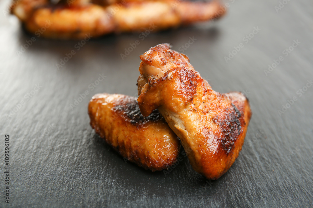 Baked chicken wings on slate plate Baked chicken wings on slate plate