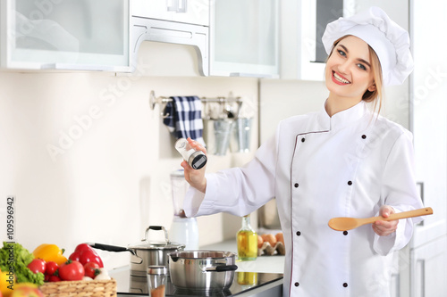 Young woman cooking in the ...