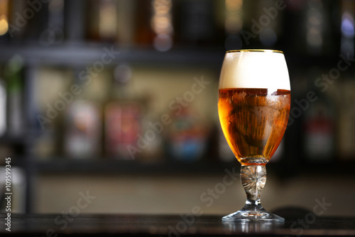 Glass of beer in a bar, close up