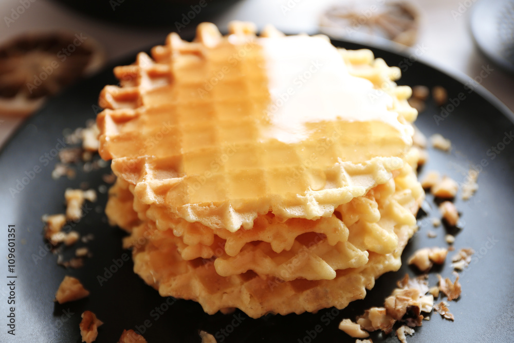 Fresh tasty waffles with honey, closeup Fresh tasty waffles with honey, closeup