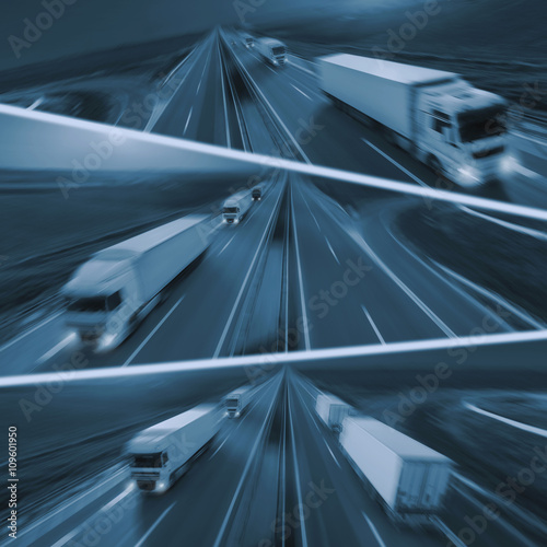 Fast delivery trucks in motion blur on highway