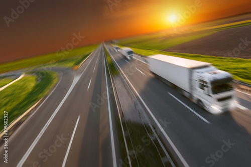 Motion image of new delivery trucks on the highway
