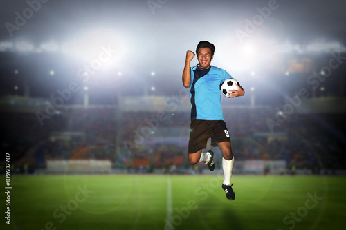 soccer football player young man happiness holding ball jump and © tuiphotoengineer