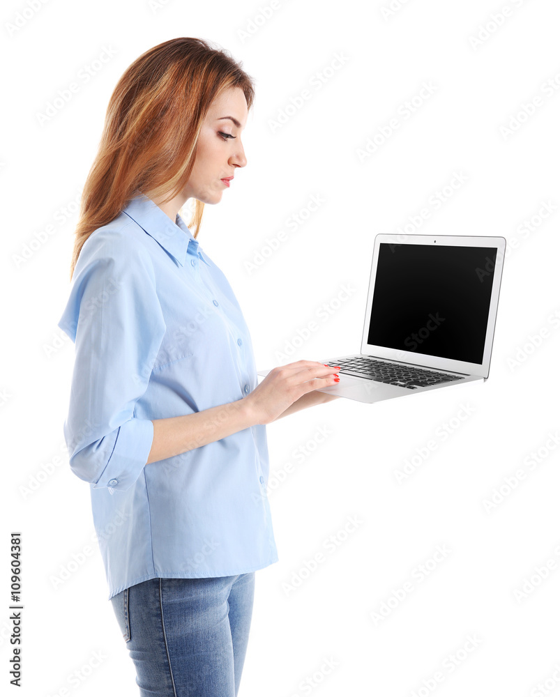 Young woman in blue shirt using laptop, isolated on white Young woman in blue shirt using laptop, isolated on white