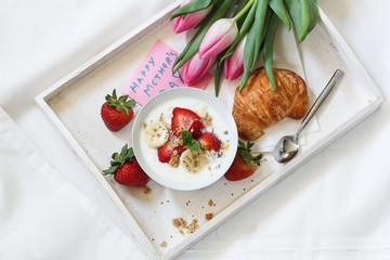 Mother's day breakfast or Brunch / Breakfast yogurt bowl with berries and croissant