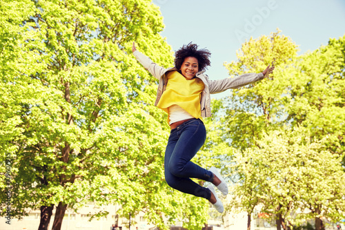 happy african american young woman in summer park © Syda Productions