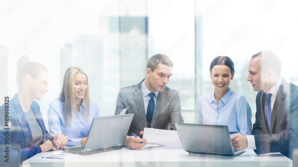 business team with laptop having discussion business team with laptop having discussion