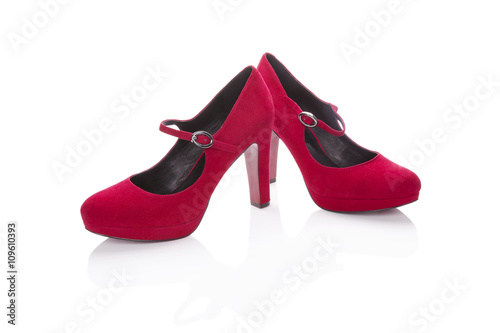 Red high heels isolated on white.