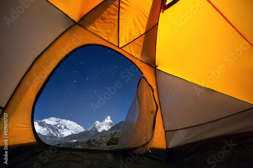View of the mountains from a tourist tent. From the «window» from left to right there are two eight-thousanders - Mt. Everest (8,848 m), Lhotse (8,516 m) and Ama Dablam (6,814 m). photo