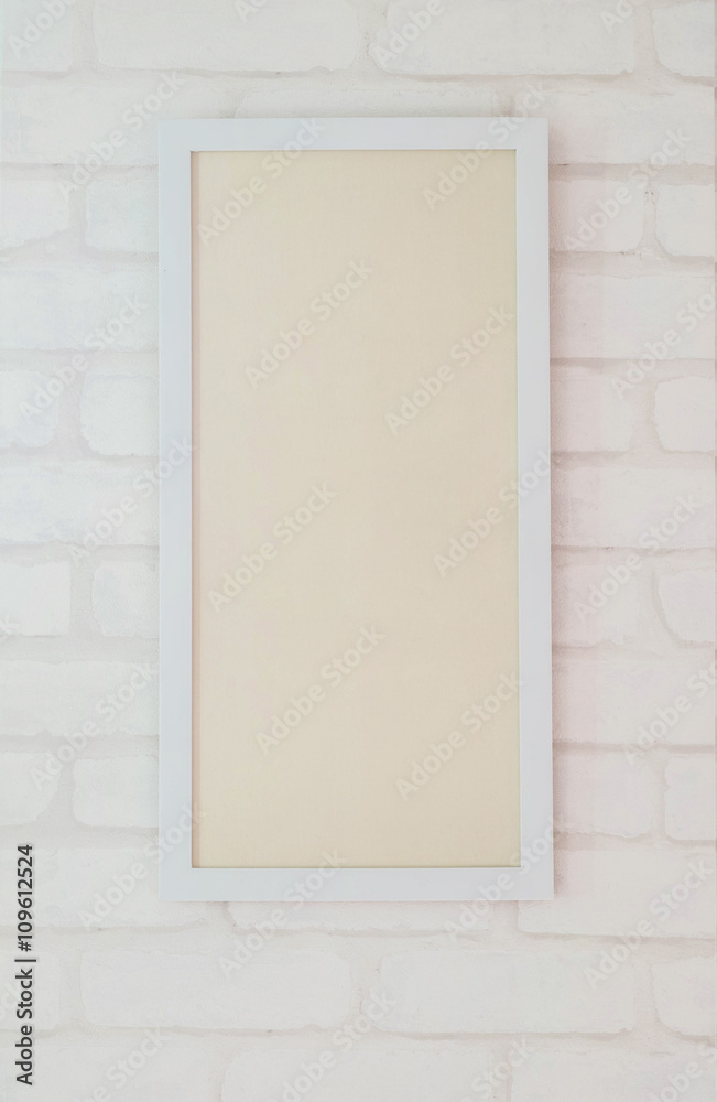White frame for photo on brick wallpaper background White frame for photo on brick wallpaper background