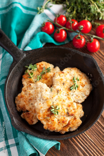 Grilled chicken meatballs on a skillet