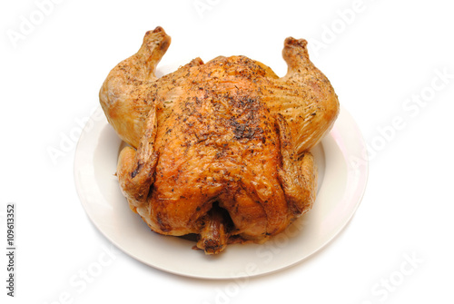 Whole Roasted Chicken on a Round White Platter photo