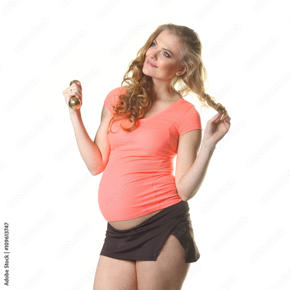 Pregnant woman in for sports. Pregnant woman doing exercise with dumbbells. Pregnant woman exercising with training weights Pregnant woman in for sports. Pregnant woman doing exercise with dumbbells. Pregnant woman exercising with training weights