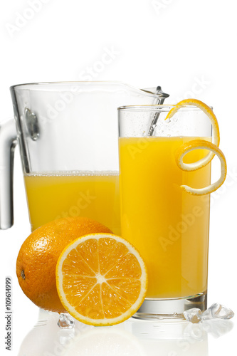 orange juice in glass and a jar.