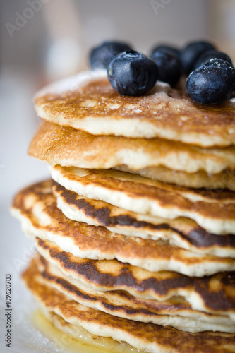 Pancakes with raspberries, blueberries and honey
