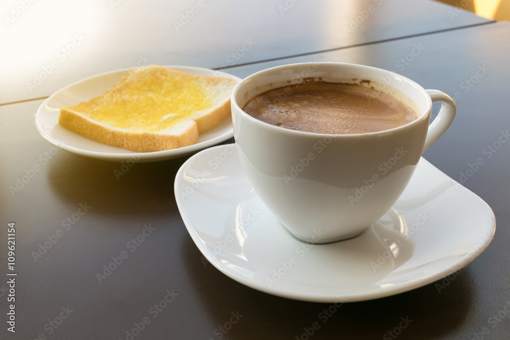 cup of coffee toast with butter. Morning light cup of coffee toast with butter. Morning light