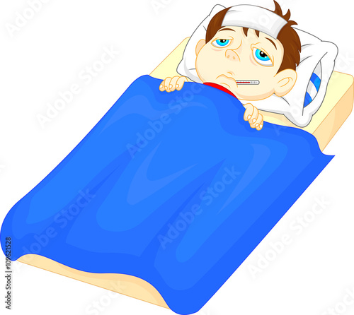 Sick boy in bed with symptoms of fever and thermometer in his mouth