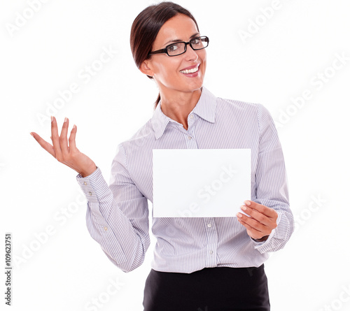 Excited brunette businesswoman with a signboard