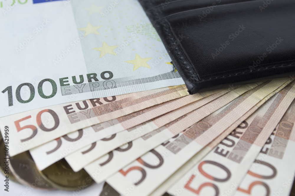 banknotes with a purse on a white background
banknotes with a purse on a white background