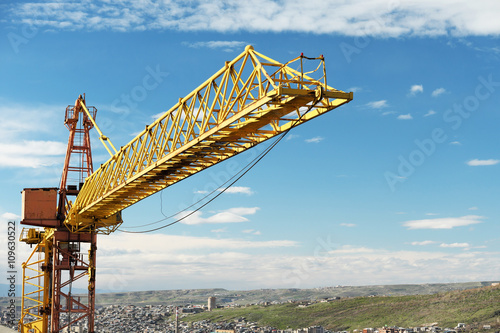 Crane tower against a blue sky