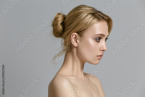 beautiful model lady with natural make-up and blonde hair studio
