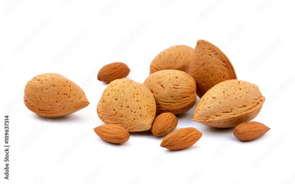 Heap of fresh almonds in shells isolated on white background Heap of fresh almonds in shells isolated on white background